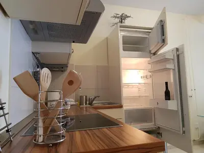 a kitchen with a counter top and a refrigerator at Apartment Ranc in Kranjska Gora