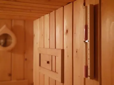 an open door in a room with wooden walls at Apartment Ranc in Kranjska Gora
