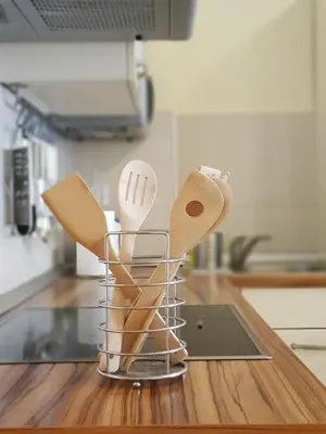 a group of wooden utensils sitting on a kitchen counter at Apartment Ranc in Kranjska Gora