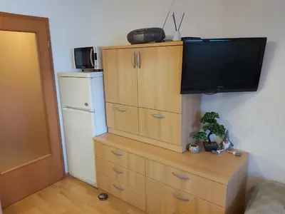 a dresser with a television on top of it at Apartma Happy in Kranjska Gora