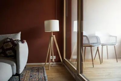 a room with a mirror and a lamp and a chair at Our Second Home in Kranjska Gora in Kranjska Gora