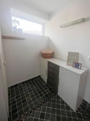 a room with a desk and a window at Lovely basement rental in Bled