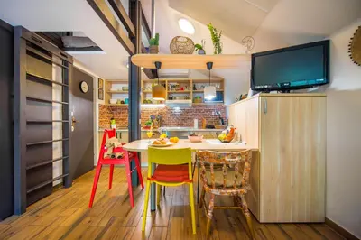 a kitchen with a yellow table and chairs at Boho House 3 camp Terme Catez with promotional tickets prices in Čatež ob Savi