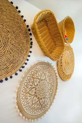 a plate and two straw baskets and a plate with a design on it at Boho House 3 camp Terme Catez with promotional tickets prices in Čatež ob Savi