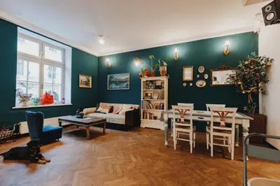 a living room with a couch and a table at Party Hostel Zzz in Ljubljana
