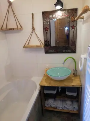 a bathroom with a large tub and a sink at LES CHALET Kranjska Gora I in Kranjska Gora