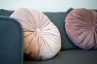 two pillows are sitting on a couch at Resort na jasi in Zreče