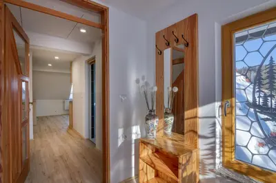 a hallway with a mirror and a vase at Farmhouse Raspberry Pool&Wellness - Happy Rentals in Vransko