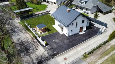 an overhead view of a white house with a roof at Apartmaji ENIA Rateče-Planica, Kranjska Gora in Kranjska Gora