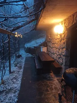 a room with a wooden bench in a stone building at Serenity in Dramlje