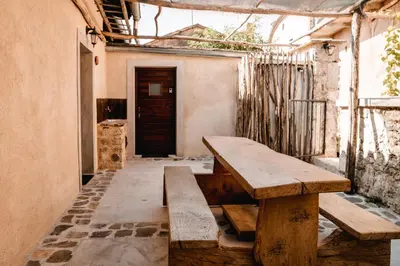 a wooden bench sitting inside of a room at Vila Ana in Štanjel