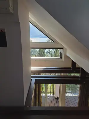a large window in a room with a wooden floor at BALCON Apartments in Bled