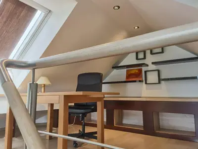 a dining room with a table and a chair at BALCON Apartments in Bled
