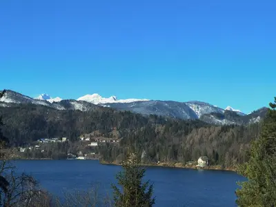 a view of a lake with mountains in the background at BALCON Apartments in Bled