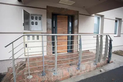 a metal railing on the outside of a building at Rooms Bolero Naklo in Naklo