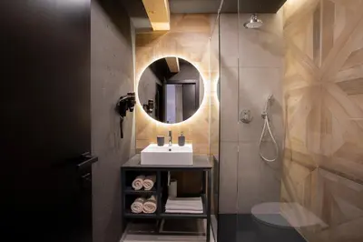 a bathroom with a sink and a mirror at Rooms Bolero Naklo in Naklo