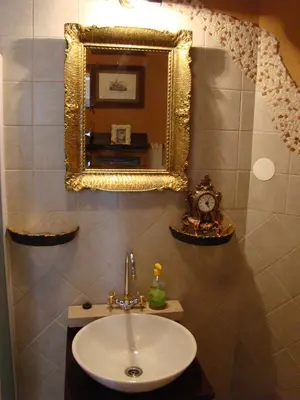 a bathroom with a sink and a mirror on the wall at Oriana Studios in Bled