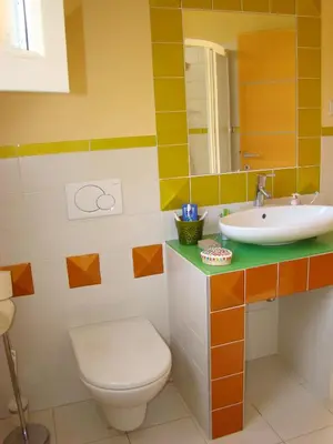 a bathroom with a toilet and a sink at Oriana Studios in Bled