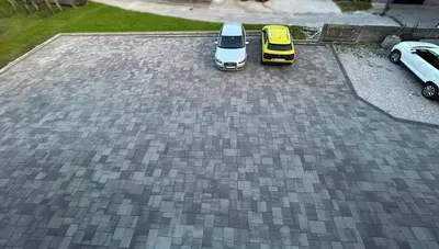 two cars parked on top of a driveway at Perfect Place Apartments in Kranj