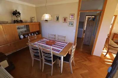 a dining room with a table and chairs at Vintage Apartment Bled in Bled