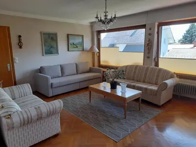 a living room with two couches and a coffee table at Vintage Apartment Bled in Bled