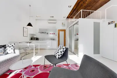 a living room with a couch and a table and chairs at Fine Ljubljana Apartments in Ljubljana
