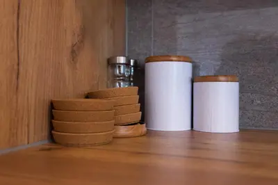 a couple of containers sitting on top of a shelf at Apartma Tia in Zreče