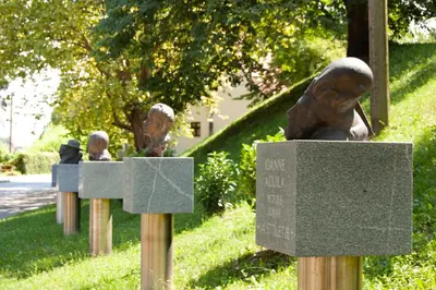 a group of statues of people in a park at Fado Apartments Gornja Radgona in Gornja Radgona