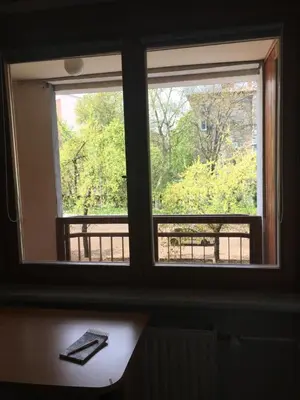 two windows in a room with a table and a keyboard at Road View Apartment Celeia in Celje