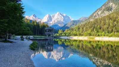 a view of a river with mountains in the background at Apartma Uršič in Kranjska Gora