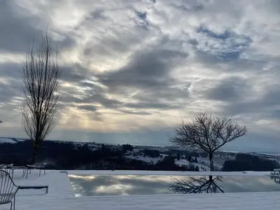 a view of a snow coveredinionasteryasteryasteryasteryasteryasteryasteryasteryastery at SIBON Wine & Spa Resort Jeruzalem in Ljutomer
