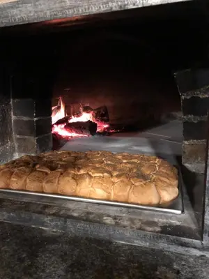 a loaf of bread is coming out of an oven at SIBON Wine & Spa Resort Jeruzalem in Ljutomer