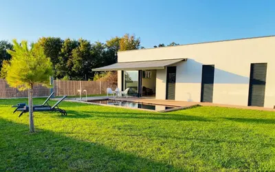 a house with a swimming pool in a yard at VOO residence in Malečnik