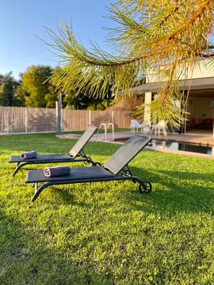 two picnic tables on the grass in a yard at VOO residence in Malečnik