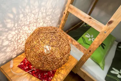 a nest on top of a wooden table at Cottage Suha in Bohinj