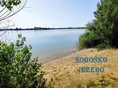 a sign on the shore of a body of water at Apartma MAX in Moravske Toplice