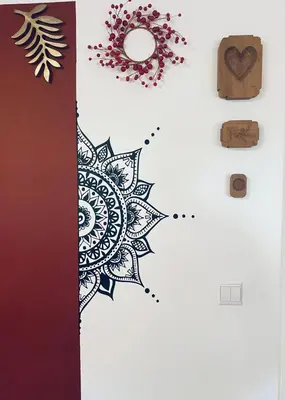 a wall with a mandala design on it at Apartma KAMNITNK in Škofja Loka