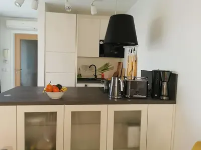a kitchen with a counter with a bowl of fruit on it at Apartman PIKY No.10 in Moravske Toplice