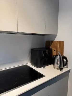 a kitchen counter with a toaster and a tea pot at OTTA Apartments Golte C2 in Mozirska Koča