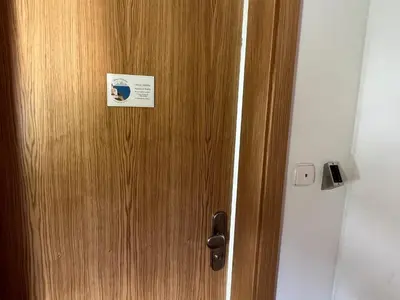 a wooden door with a sign on it at Gloria Holiday - Apartment Bohinj in Bohinj