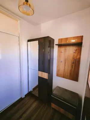 a hallway with a black elevator and wooden floors at See You House, Terme Čatež 153 in Čatež ob Savi