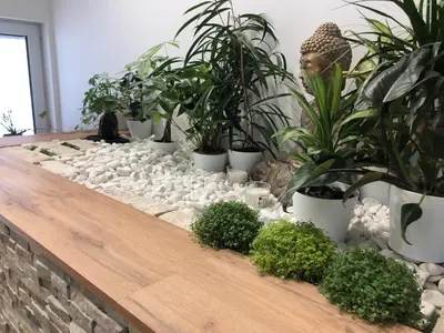 a long wooden table with plants on it at Garden House in Kranj
