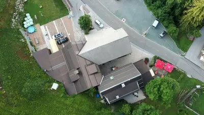 an overhead view of a house with a roof at Farm Stay Trlej in Begunje na Gorenjskem