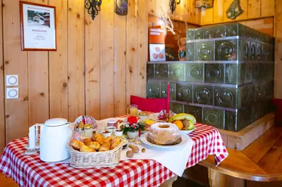 a table with a plate of food on a table at Farm Stay Trlej in Begunje na Gorenjskem