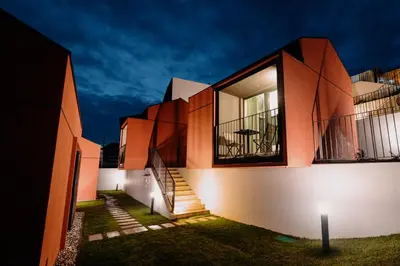 a house with a staircase on the side of it at Glamping Senesalina in Kojsko