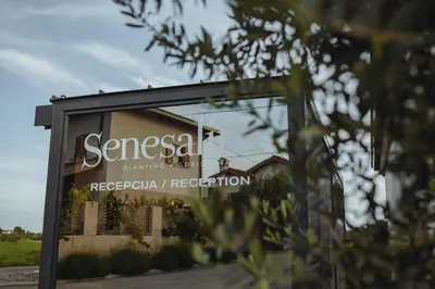 a sign that reads sensesani dining and reception at Glamping Senesalina in Kojsko