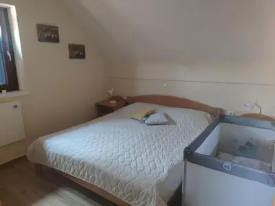 a small bedroom with a bed and a window at DEMI108 - Terme čatež - pool tickets included in Čatež ob Savi