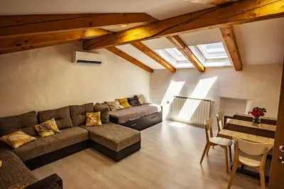 a living room with a couch and a table at Toncevi Eco Estate in Branik