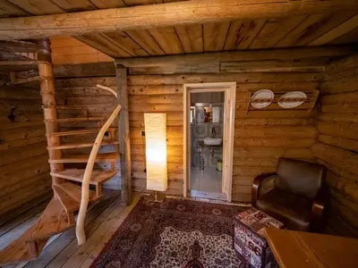 a room with a staircase in a log cabin at Chalet Sejalec in Lesce