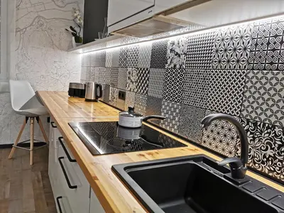 a kitchen with a sink and a stove top oven at CITYMAP HOTEL APARTMENTS Maribor-Free parking! in Maribor